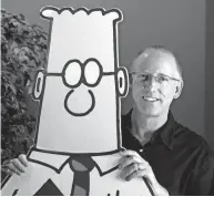  ?? MARCIO JOSE SANCHEZ/AP ?? Scott Adams with the titular character in the comic strip “Dilbert” in 2006.