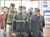  ?? ?? Police escort Aaftab Poonawala (masked) out of Delhi’s Forensic Science Laboratory after he took a polygraph test on Thursday.