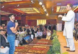  ?? PTI ?? Congress vicepresid­ent Rahul Gandhi interacts with boxer Vijender Singh at the 112th PHD Chamber's Annual Session & Awards for Excellence 2017 in New Delhi on Thursday.