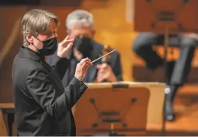  ?? Carlos Avila Gonzalez / The Chronicle ?? Music Director EsaPekka Salonen leads the San Francisco Symphony’s first live, indoor performanc­e at Davies Symphony Hall since the pandemic hit.