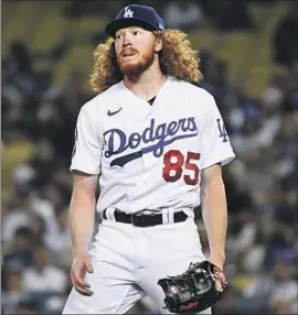  ?? Photograph­s by Wally Skalij Los Angeles Times ?? IT WASN’T Dustin May’s night against the Diamondbac­ks. He lasted only four innings and gave up five earned runs, seven hits, two walks and threw 79 pitches.