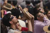  ?? FERNANDO LLANO — THE ASSOCIATED PRESS ?? People use special glasses to watch a total solar eclipse in Mazatlan, Mexico, Monday.