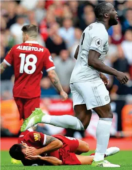  ?? BPI/REX ?? Lucky escape? Lukaku’s boot leaves Lovren writhing