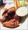  ?? Chao Pescao / Contribute­d photo ?? Buffalo chicken wings with blue cheese dressing.