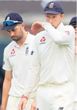  ??  ?? Dejected England captain Joe Root. He remains confident his team can turn things round for the second Test.