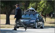  ?? KRISTOPHER SKINNER/BAY AREA NEWS GROUP ?? An Acura RLX equipped with autonomous vehicle technology slows to avoid a pedestrian in a sidewalk as it is demonstrat­ed at the former Concord Naval Weapons Station on June 1, 2016 in Concord.