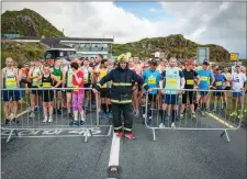  ??  ?? Fireman Chris Price from Kanturk pictured with some of halfmarath­on crowd at the ‘Run Killarney’ event on Saturday morning.