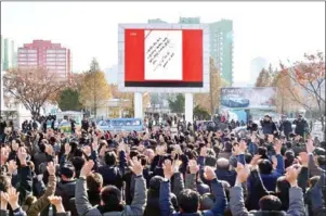  ?? AFP PHOTO/KCNA VIA KNS ?? This photo taken on Wednesday and released on yesterday by North Korea’s official Korean Central News Agency shows people in Pyongyang celebratin­g the test of a Hwasong15 interconti­nental ballistic missile. Russia yesterday rejected a US call to cut...