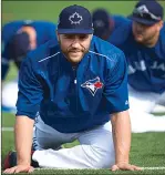  ?? Canadian Press photo ?? Toronto Blue Jays catcher Russell Martin stretches during baseball spring training in Dunedin, Fla.