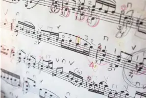  ??  ?? Sheet music is seen inside of Caesar Sant's home in Memphis on June 25. At 2 years old, Caesar began learning to play the violin, and by 4 years old, he played the National Anthem at baseball games.