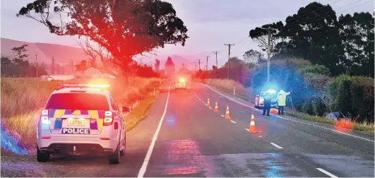  ?? PHOTO: STEPHEN JAQUIERY ?? Police work at the scene of a fatal car accident near Palmerston yesterday.