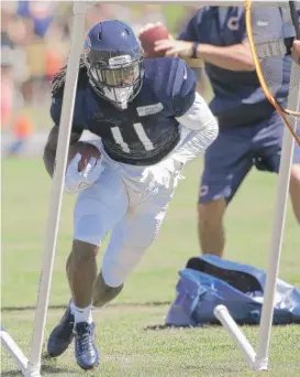  ?? | NAM Y. HUH/ AP ?? Receiver Kevin White takes part in drills during Bears training camp in Bourbonnai­s. Receivers coach Zach Azzanni wants him to stay positive.