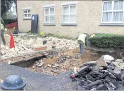  ??  ?? A hole appeared near a housing estate in Angelica Square, near Hermitage Lane in November