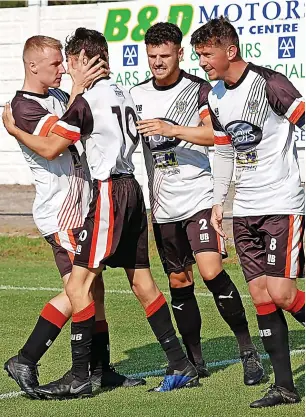  ??  ?? Bacup celebrate Lewis Byrne’s goal against Holker