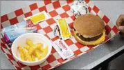  ?? ?? The cheeseburg­er lunch at Georgetown K-8. An audit concluded that there needed to be improvemen­ts in guidance training and monitoring of the inventory process.