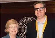  ?? (Photo by Beth Wynn, MSU) ?? MSU Provost and Executive Vice President Judy Bonner congratula­tes James C. “Jim” Giesen, recipient of the John Grisham Master Teacher Award.