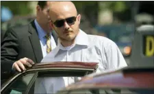  ?? CLIFF OWEN — THE ASSOCIATED PRESS FILE ?? In this file photo, former Blackwater Worldwide guard Nicholas Slatten enters a taxi cab as he leaves federal court in Washington, after the start of his trial. A federal judge has sentenced a former Blackwater security contractor to life in prison for his role in the 2007 shooting of unarmed civilians in Iraq.