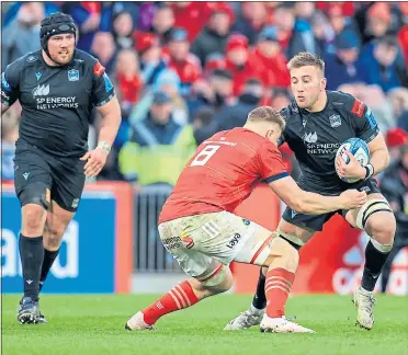  ?? ?? Brother in arms – Munster’s Gavin Coombes tackles Glasgow’s Matt Fagerson as brother Zander looks on