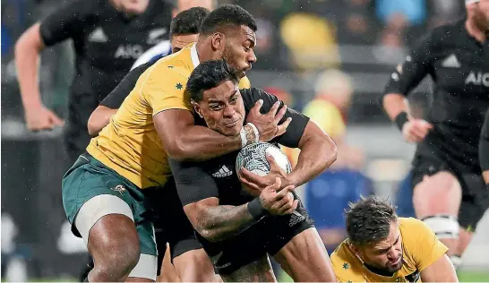  ?? GETTY IMAGES ?? Malakai Fekitoa is tackled around the neck in a bitter but one-sided Bledisloe Cup test match in Wellington last night.