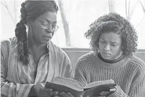  ??  ?? Gugu Mbatha-Raw, right, stars as a woman with superpower­s who reconnects with her mom (Lorraine Toussaint) while on the run in “Fast Color.” JACOB YAKOB