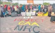  ??  ?? Muslim women, children stage a protest against CAA and NRC near ■
Ghantaghar in Lucknow on January 20. PTI FILE