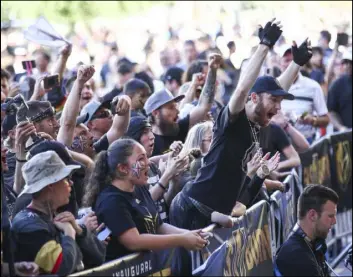  ?? Chase Stevens Las Vegas Review-Journal ?? Golden Knights fans cheer in Toshiba Plaza on May 16 before Game 3 of the Western Conference finals against the Winnipeg Jets at T-Mobile Arena.