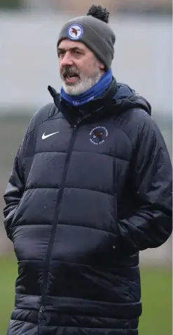  ?? ?? Ballinamal­lard United manager, Tommy Canning, watches on at Wilgar Park against Dundela. Image: Mervyn Smyth