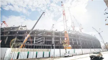  ??  ?? Picture shows a general view of the constructi­on site for the National Stadium, venue for the upcoming Tokyo 2020 Olympic Games, in Tokyo. Tokyo 2020 organisers unveiled a ‘significan­t’ cut in their budget for hosting the games, as the city comes under...