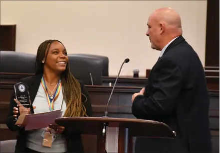  ?? SUBMITTED PHOTO ?? Chester County Juvenile Probation director Don Corry presents the Juvenile Probation Officer of the Year to Danielle Crampton last week.