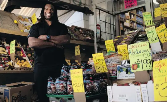  ?? ALLEN MCINNIS ?? Former Canadien Georges Laraque, shown at a Parc Avenue produce stand, says he does a lot of public speaking engagement­s around the world on his vegan lifestyle.