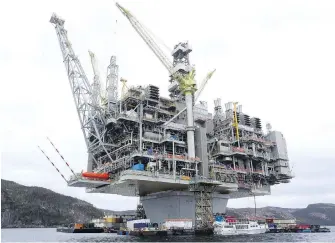  ??  ?? The Hebron platform, anchored in Trinity Bay, N.L., is a vital part of Newfoundla­nd and Labrador’s offshore oil activity.