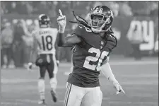  ?? BILL KOSTROUN/AP PHOTO ?? New York Giants cornerback Janoris Jenkins gestures after breaking up a pass intended for Chicago Bears wide receiver Taylor Gabriel, back, on the final play of overtime in Sunday’s game.