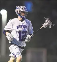  ?? Matthew Brown / Hearst Connecticu­t Media ?? Darien’s Tommy Hellman moves upfield during the Blue Wave’s 96 victory over Staples in the Class L state tournament semifinals at Brien McMahon in Norwalk on June 5.