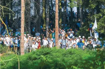  ??  ?? Participan­ts, some of them survivors of the 1995 Srebrenica massacre, walk through a mountain forest near Nezuk, in Bosnia, on Wednesday, during a Peace March recreating the path taken 26 years ago by people trying to escape the advancing Bosnian Serb forces. The three-day event commemorat­es more than 8,000 Bosnian Muslim men and boys who perished in 10 days of slaughter after Srebrenica was overrun by Bosnian Serb forces on July 11, 1995, during Bosnia’s 1992-95 war.