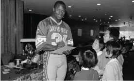 ?? Photograph: Tsugufumi Matsumoto/AP ?? Bo Jackson signs autographs for young fans in the run-up to the Japan Bowl.