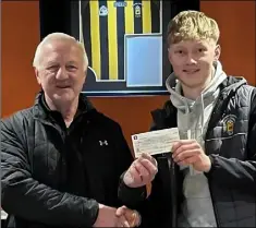 ?? ?? Mike O’Mahony, Abbeydorne­y Hurling Club Treasurer (left) presents a cheque for €1,000 to Sam Griffin who won first prize in the club’s monthly draw for February.