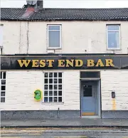  ??  ?? Crucial equipment The defibrilla­tor on the wall (left) at the West End Bar in Airdrie