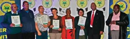  ??  ?? Pieter Kleinbooi, Rudolph Treurnicht, Charly Daman, Fibi Bass, Christina Meyer and Sara Martin from Pacaltsdor­p received certificat­es of appreciati­on from Maj-Gen Oswald Reddy and CPF chairman, Isaac Dikgachi.