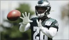  ?? MATT ROURKE – THE ASSOCIATED PRESS ?? Eagles rookie running back Miles Sanders, out of Penn State, catches a pass during a recent practice at the NovaCare Complex.