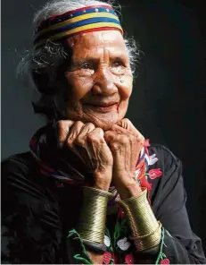  ?? — ZULAZHAR SHEBLEE/ The Star ?? Significan­t loss: A file photo of Ranyu showing her arm rings, which symbolise beauty among the Semban, a sub-tribe of the Bidayuh peoples of Sarawak. With her passing, there are now only four ‘ring ladies’ remaining.