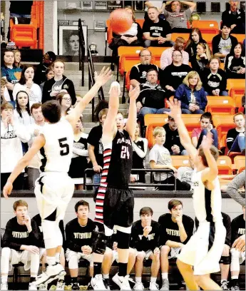  ?? TIMES photograph­s by Annette Beard ?? Senior Blackhawk Westin Church’s 3-point shooting helped the Blackhawks offset the first two field goals by the Apaches in the early going.