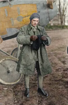  ??  ?? ■ Sebastian Festner suits up in front of an Albatros fighter at Roucourt airfield. (Colour by Johnny Sirlande)