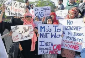  ??  ?? Youngsters hold posters during the protest march in Jaipur.
. PRABHAKAR SHARMA/HT PHOTO