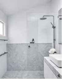  ??  ?? 4. Ensuite freshness with Carrara marble tiles from Tiles 4 Less and white porcelain squares from Tiles By Kate.
4