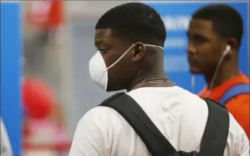  ?? Octavio Jones/Tampa Bay Times ?? Toronto Blue Jays minor-leaguer Luis De Los Santos and his teammates prepare to fly home to the Dominican Republic from Tampa Internatio­nal Airport on Sunday.