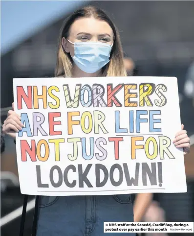  ?? Matthew Horwood ?? > NHS staff at the Senedd, Cardiff Bay, during a protest over pay earlier this month