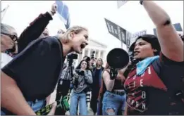  ?? ?? Pro-choice and anti-abortion activists demonstrat­e outside the US Supreme Court on Tuesday. (Right) US President Joe Biden