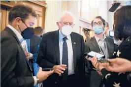  ?? AL DRAGO/THE NEW YORK TIMES ?? U.S. Sen. Bernie Sanders, I-Vt., seen talking to reporters Oct. 6, is very upset that the Democrats’“Build Back Better”package is stalled.