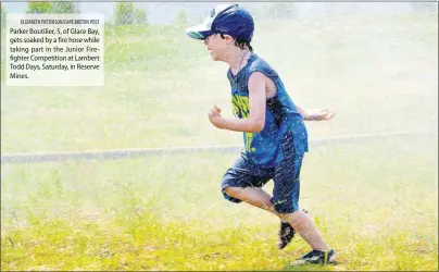  ?? ELIZABETH PATTERSON/CAPE BRETON POST ?? Parker Boutilier, 5, of Glace Bay, gets soaked by a fire hose while taking part in the Junior Firefighte­r Competitio­n at Lambert Todd Days, Saturday, in Reserve Mines.