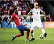  ?? AP PHOTO BY JULIO CORTEZ ?? U.S. midfielder Michael Bradley, right, and Costa Rica midfielder Celso Borges compete for the ball during the first half of a World Cup qualifying soccer match, Friday, in Harrison, N.J.